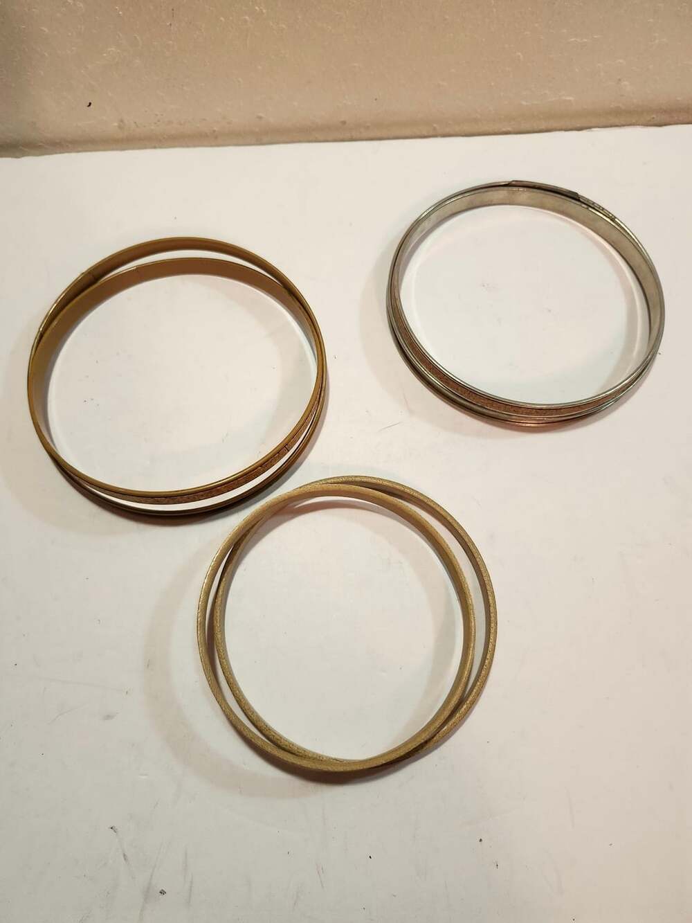 Unbranded 2 Metal Rings Bangle Bracelets and smaller wooden ring.